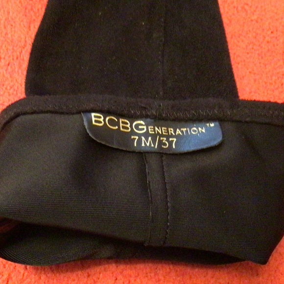 🔥SALE🔥NWOT BCBGENERATION Black Sock Heels Boots with Gold Accents - Picture 3 of 3